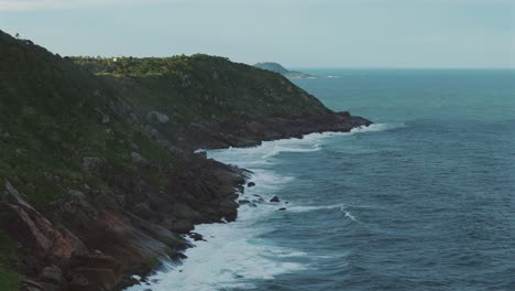 waves crash against the rocky coast of brazil