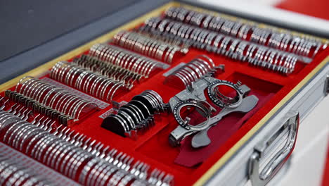 set of different lenses in the case. ophthalmologist's box with lenses for trial frame. medical tools for spectacles. close-up.