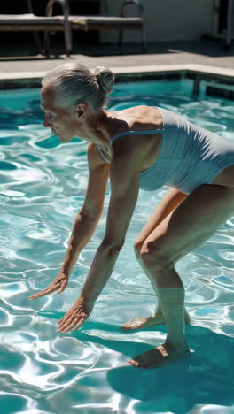 senior woman swimming in a pool