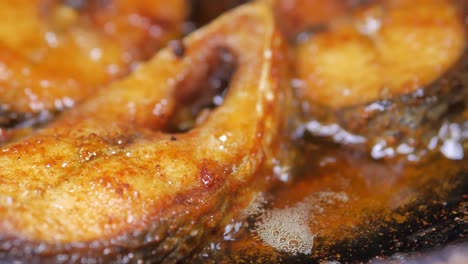 Close-up-of-frying-ilsha-fish-in-deep-oil