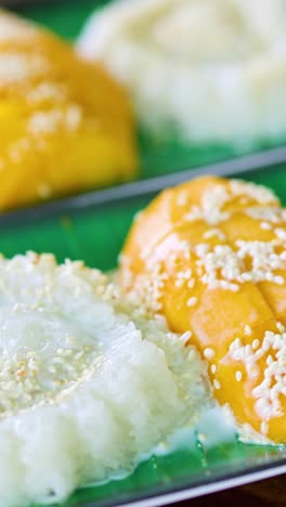 hand serving traditional thai dessert on a plate