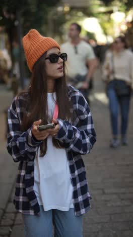 stylish young woman walking on the street