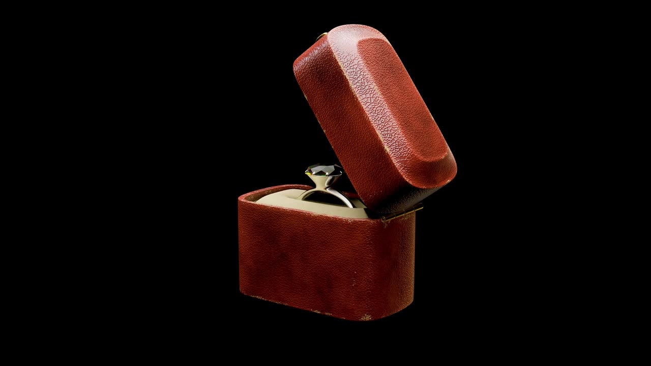 3d rendering rotates looping motion graphic of the diamond ring in a tiny retro box with alpha channel section.