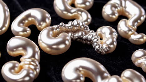 abstract pearl shapes on black velvet