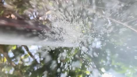 water pouring onto camera lens outdoor