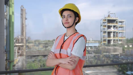 Portrait-of-Indian-female-construction-worker-standing-crossed-hands