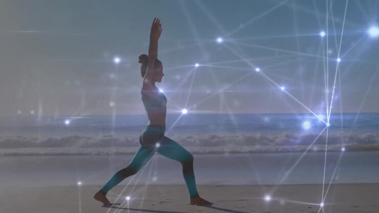 Animazione di reti di connessioni su una donna caucasica che pratica yoga in spiaggia.