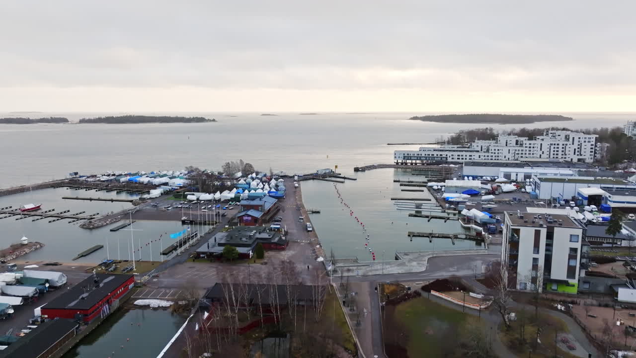 Aerial view rising over the marina, cloudy sunset in Lauttasaari, Helsinki
