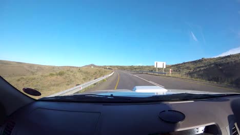 time lapse of driving vehicle at passengers side with a view of summer green fields