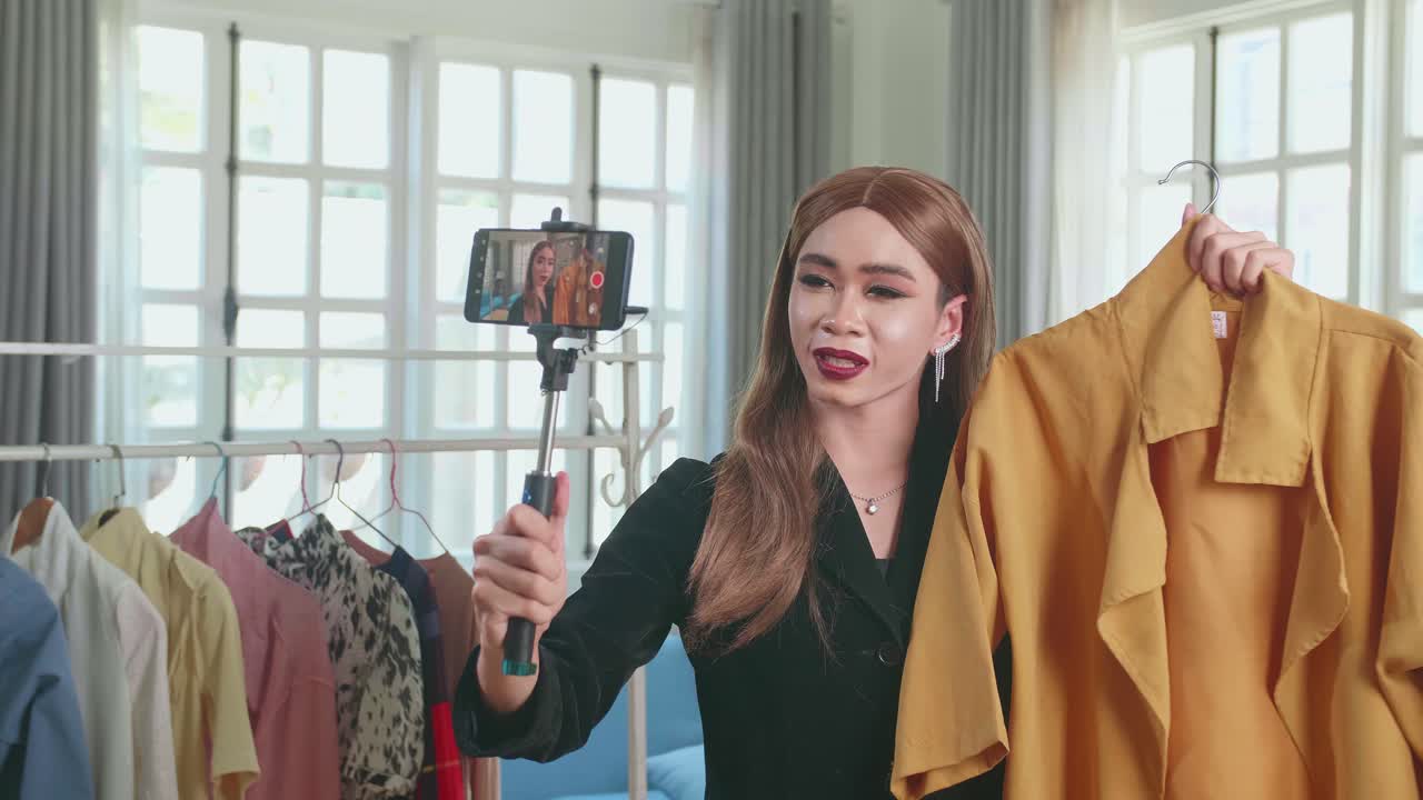 Young Transgender Woman Fashion Blogger Selling Clothes Online By Live Streaming On Mobile Phone, Selfie