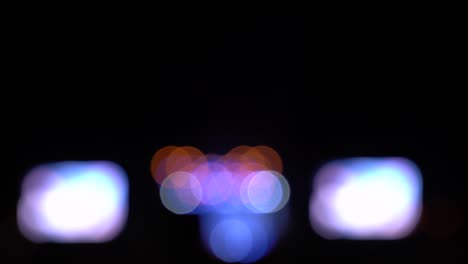 blurred bokeh traffic on the road at night in a big city,