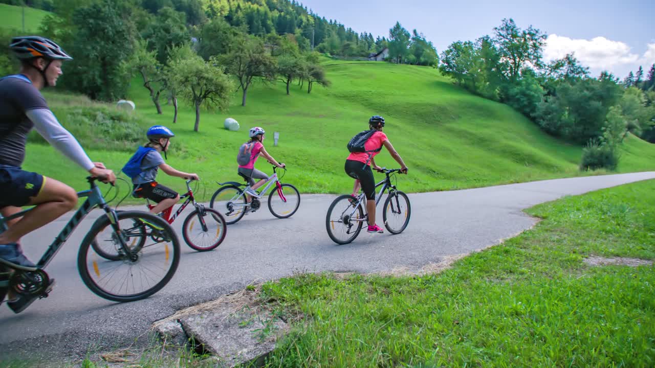 Healthy family ride bikes at park in Slovenj Gradec , Slovenia, tracking