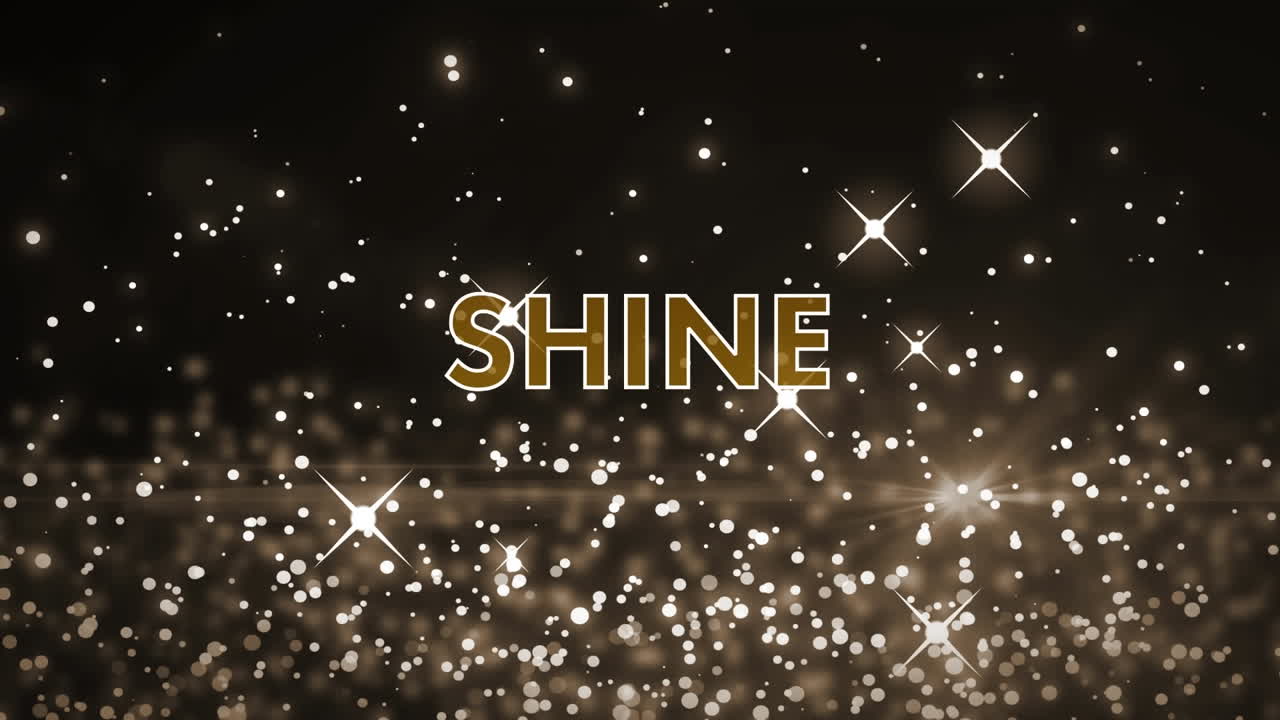 검은 바탕에 떠오르는 빛나는  ⁇  별 위에  ⁇ 색과 금색 텍스트로 빛나는 애니메이션