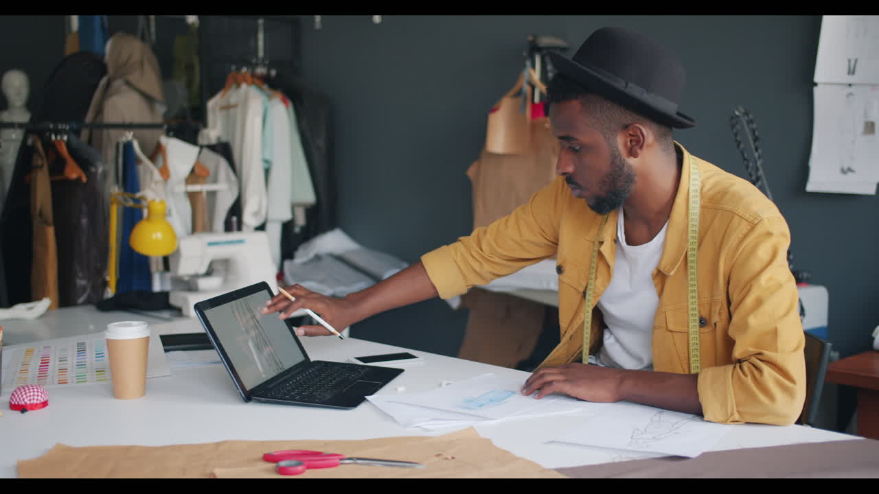 Fashion Designer Working in Studio