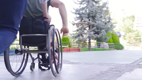 disabled young man having fun in wheelchair in slow motion.