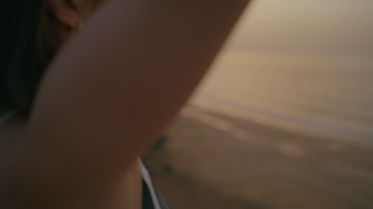 Woman Meditating on the Beach at Sunrise/Sunset
