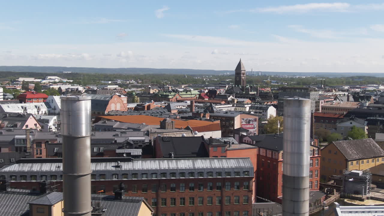 Norrkoping, Sweden - Aerial View Of Skyline Past Industrial Chimneys