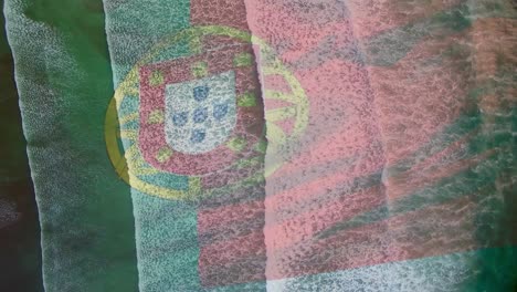 digital composition of waving portugal flag against aerial view of the sea waves