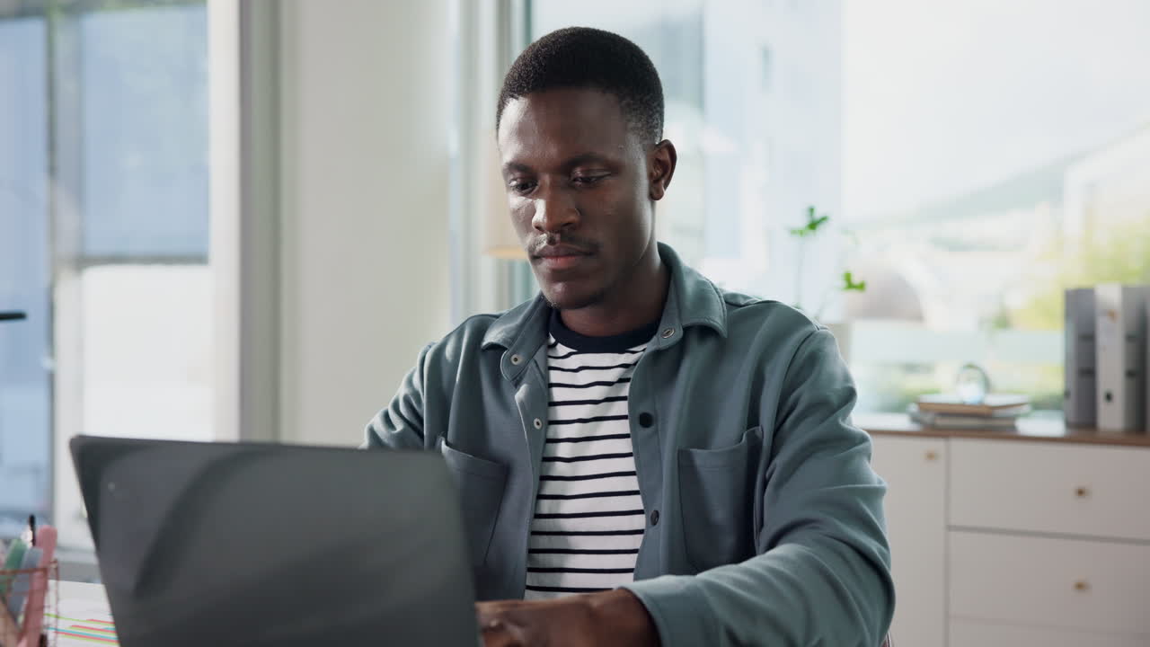 Man working on laptop at desk
