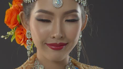 close up glamour portrait of an indian bride on her wedding day wearing traditional bohemian jewel headpiece