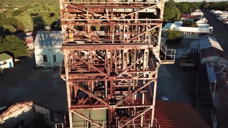 beautiful old rusty mine shaft in the middle of an old mining town in namibia called tsumeb