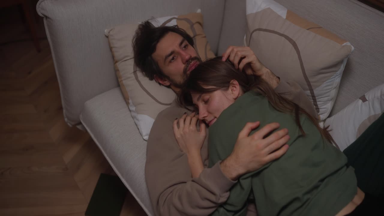 Couple Cozying Up on a Couch