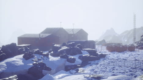 exploring an isolated research station in a snowy mountain landscape