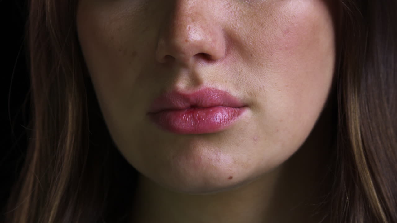 Close Up Of Unhappy Woman's Lips Trembling