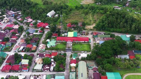 aerial view of town and municipal hall of saint bernard in southern leyte, philippines - drone shot