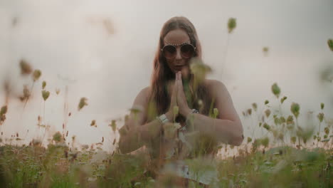 woman meditating in the bosom of nature and seeking peace and quiet