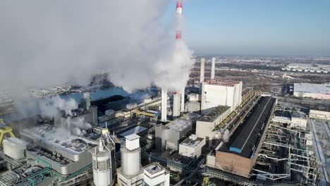 aerial view of smoke over a coal-fired thermal power plant in poland at daylight