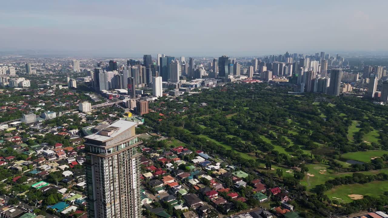 Wack Wack Golf And Country Club With Ortigas Center CBD In Pasig, Metro Manila. - aerial shot