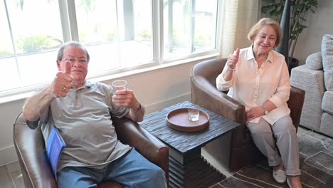 older couple relaxed and enjoying a drink in their new recreation room