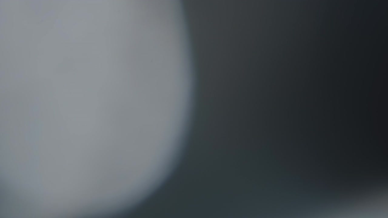 Abstract light leaks on black background.