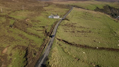 Following-car-along-hghland-road-at-Idrigil-Bay-Uig-Isle-of-Skye-Scotland