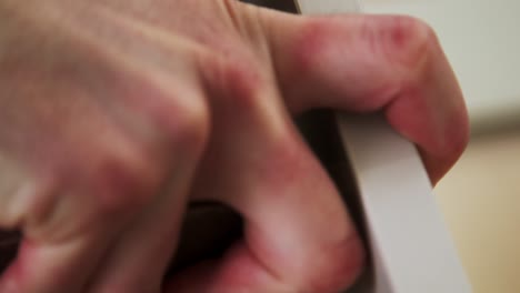 close up of caucasian hands putting together two pieces of wood