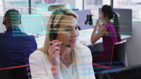 Using-headset-in-office,-businesswoman-with-computer-code-animation-in-background