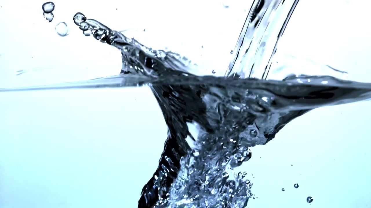 Clear Water Pouring and Splashing into a Liquid Surface