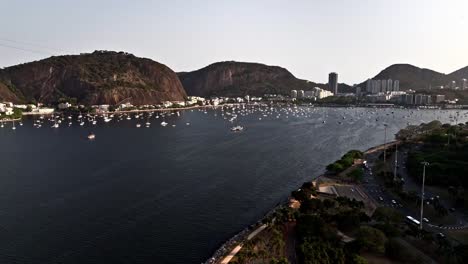 famous brazilian landmark, coastal buildings, sailboats moored, aerial