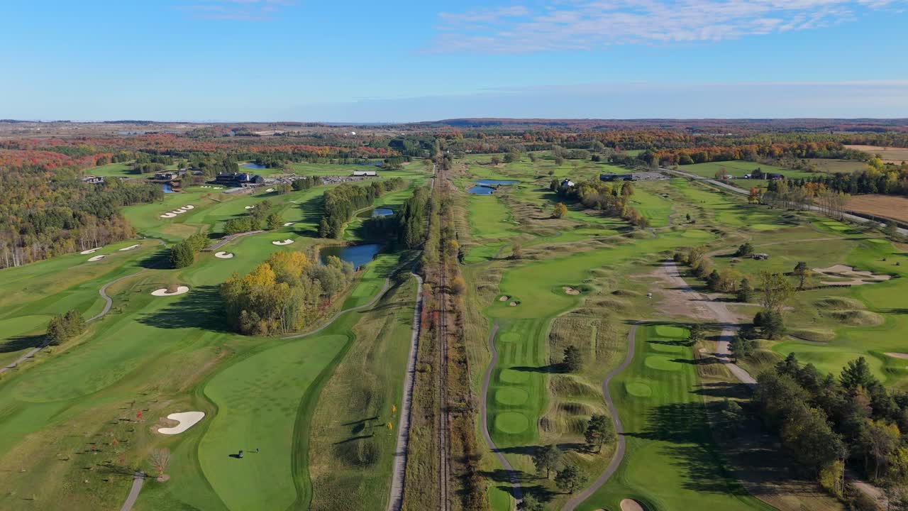 Wide aerial view of TPC Toronto at Osprey Valley, showcasing multiple championship courses, rolling fairways, bunkers, ponds, and autumn colours across the expansive golf landscape
