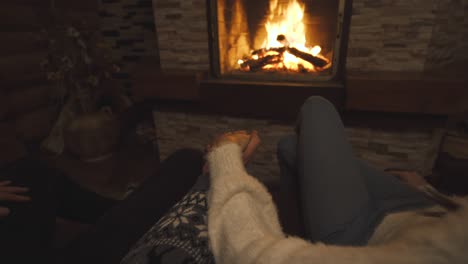 the holding hands on fireplace background