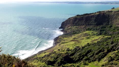 rugged terrain landscape of te toto gorge near raglan, cliffs, coastal and ocean waves, on a walk in the wilderness, new zealand aotearoa