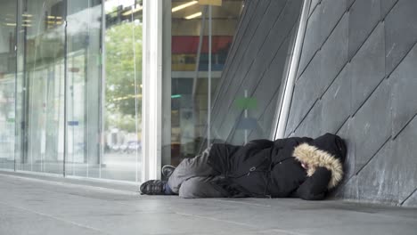 homeless person sleeping on the street