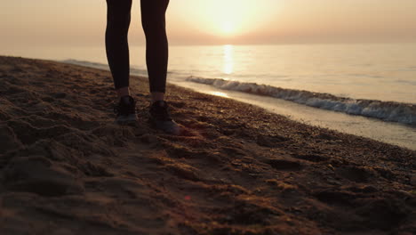 Sporty-girl-putting-down-mat-at-sunrise.-Yoga-woman-preparing-to-training.