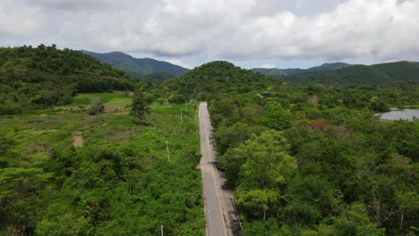 aerial footage revealing the road going in kaeng krachan national park, unesco world heritage site, thailand