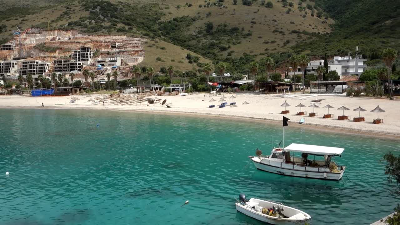 panoramic of Jale Beach in Himara, Albanian riviera. Resorts construction in background