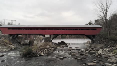 aerial zoom in the taftsville covered bridge over the ottauquechee river