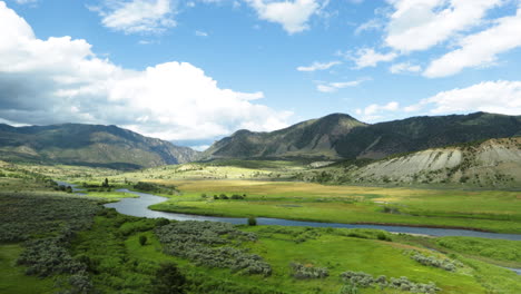 winding through a lush green valley in colorado on a train