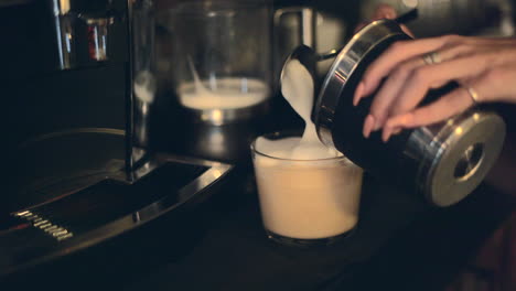 preparing a latte with a coffee machine