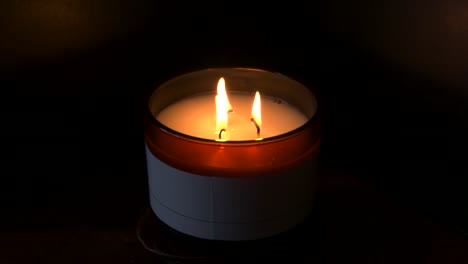 4K,-Slow-mo,-three-candles-burning-with-dark-background